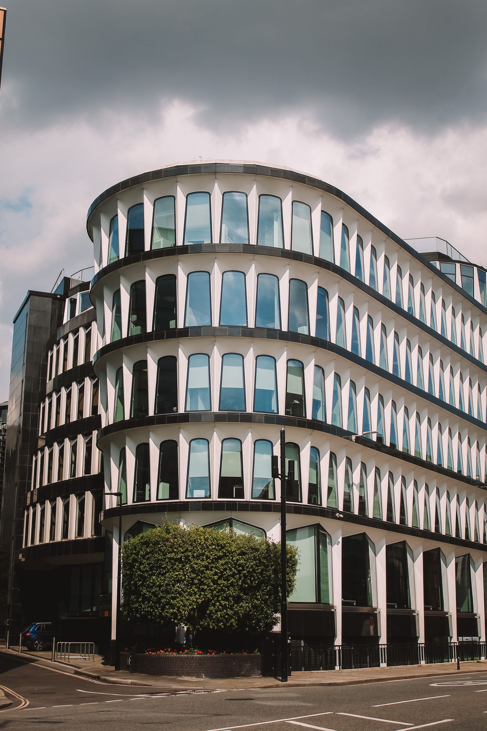 Curved glass facade of a modern City of London office building